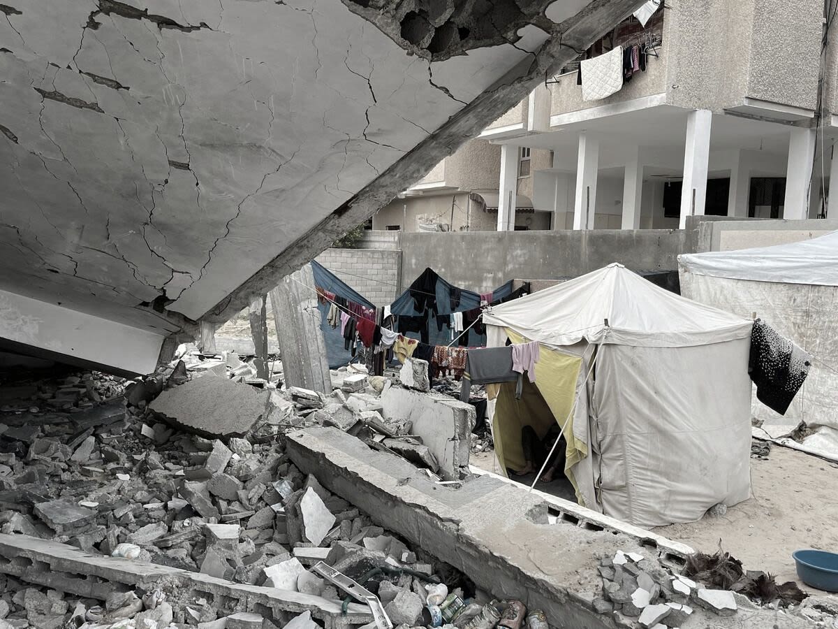 Families camped in rubble in Rafah, Gaza